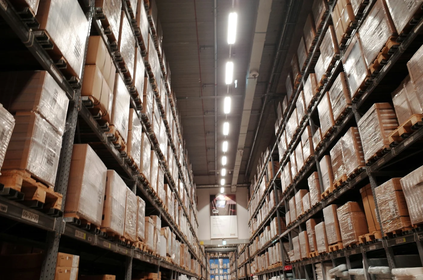 Orderly warehouse aisles with pallet racking, illustrating storage and logistics